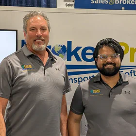 Photo of Joe McAlpin and Nayan Bhattacharyya at our booth at TIA Capital Ideas Conference.